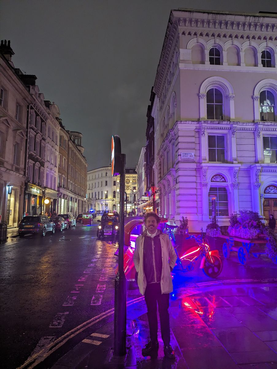 David White standing on street at night.